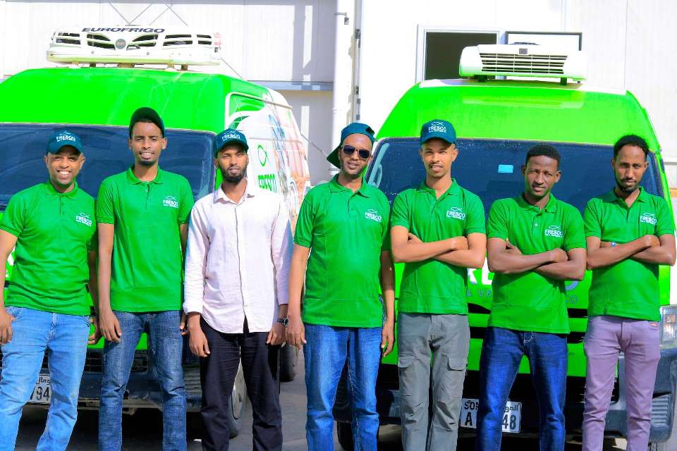 The Fresco Fish & Vegetables delivery team standing in front of the company's temperature-controlled vans
